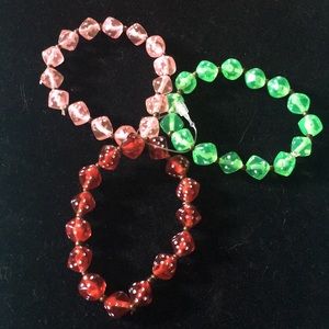 Set of 3-beaded elastic dice bracelets.